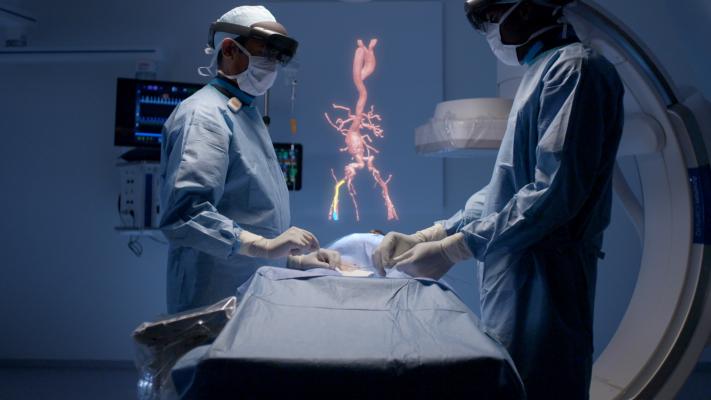 Philips and Microsoft have partnered to develop an augmented reality system to help imporve workflow and procedural navigation in the cath lab. Physicians wearing visors can view and interact with true 3-D holograms above the patient on the table and manipulate the image with voice and hand motion commands to avoid breaking the sterile field. Virtual reality in the cath lab, interventional lab, hybrid OR, or cardiovascular lab.